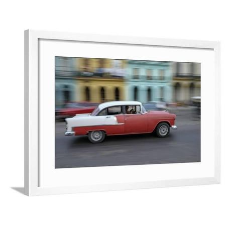 Cuba, Havana. a Classic American Car Zooms Along a City Street Framed Print Wall Art By Brenda