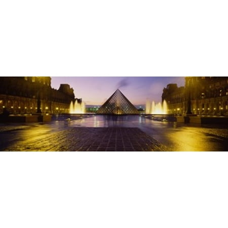 Museum lit up at night with ghosted image of three men Louvre Museum Paris France Canvas Art - Panoramic Images (18 x