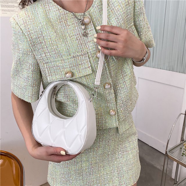 Bolso de hombro de cuero de moda Diseño de nicho de mano de PU redondo sólido para mujer