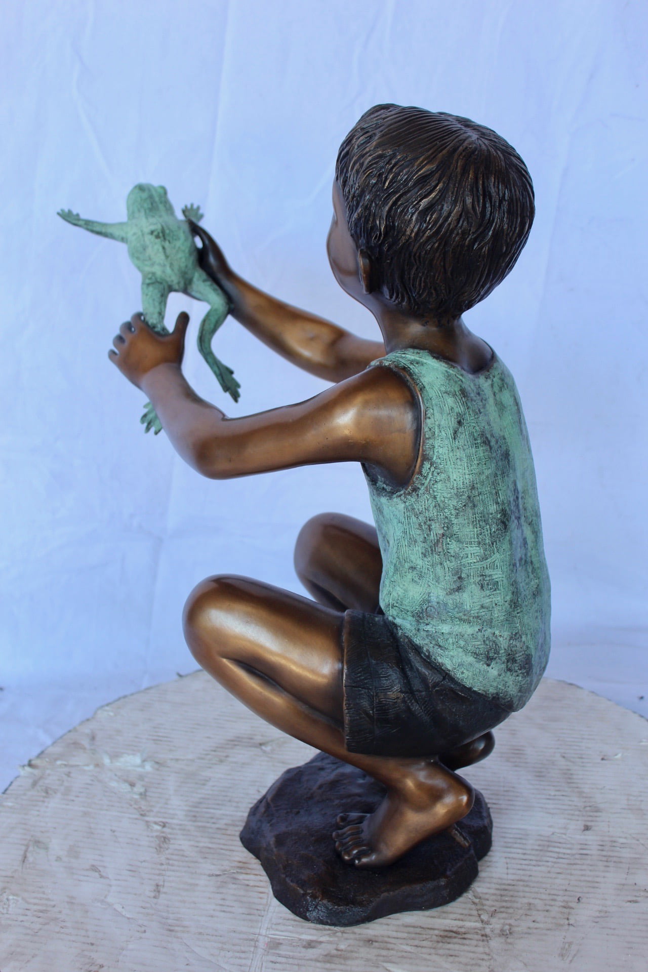 Young boy holding a frog bronze statue fountain - Size: 18L x 10W x 22H.