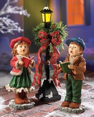 nostalgic boy and girl with lamp post