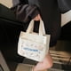 thumbnail image 3 of Organizador de ropa, almacenamiento de armario, bolso de moda, comercio exterior, ocio, viaje, bolsa de almuerzo, venta al por mayor, coreano, limpio, pequeño, fresco, todo a juego, bolso de lona, bol, 3 of 6