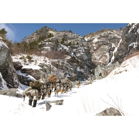February 20 2014 - US soldiers with the Army Mountain Warfare Basic Mountaineering and Advanced Instructor courses climb Smugglers Notch in Cambridge Vermont Poster