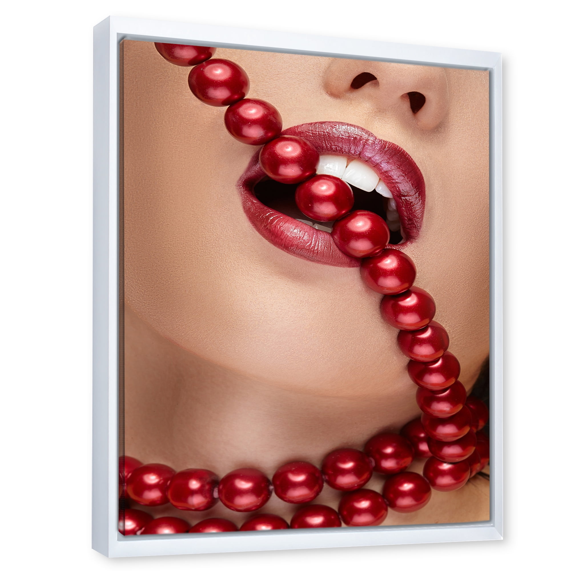 Girl Mouth With Red Lipstick Biting Red Pearls 30 in x 40 in Framed Photography Canvas Art Print, by Designart