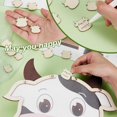 thumbnail image 4 of Libro de firmas alternativo para baby shower con temática de vacas. Incluye 100 figuras de vacas de madera, 1 vaca de madera, 1 vaca de acrílico y 1 marco de madera., 4 of 6