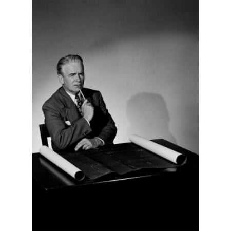 Pensive businessman smoking pipe in office Canvas Art - (18 x 24)