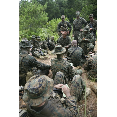 Platoon commander instructs Marines before an upcoming deployment Poster