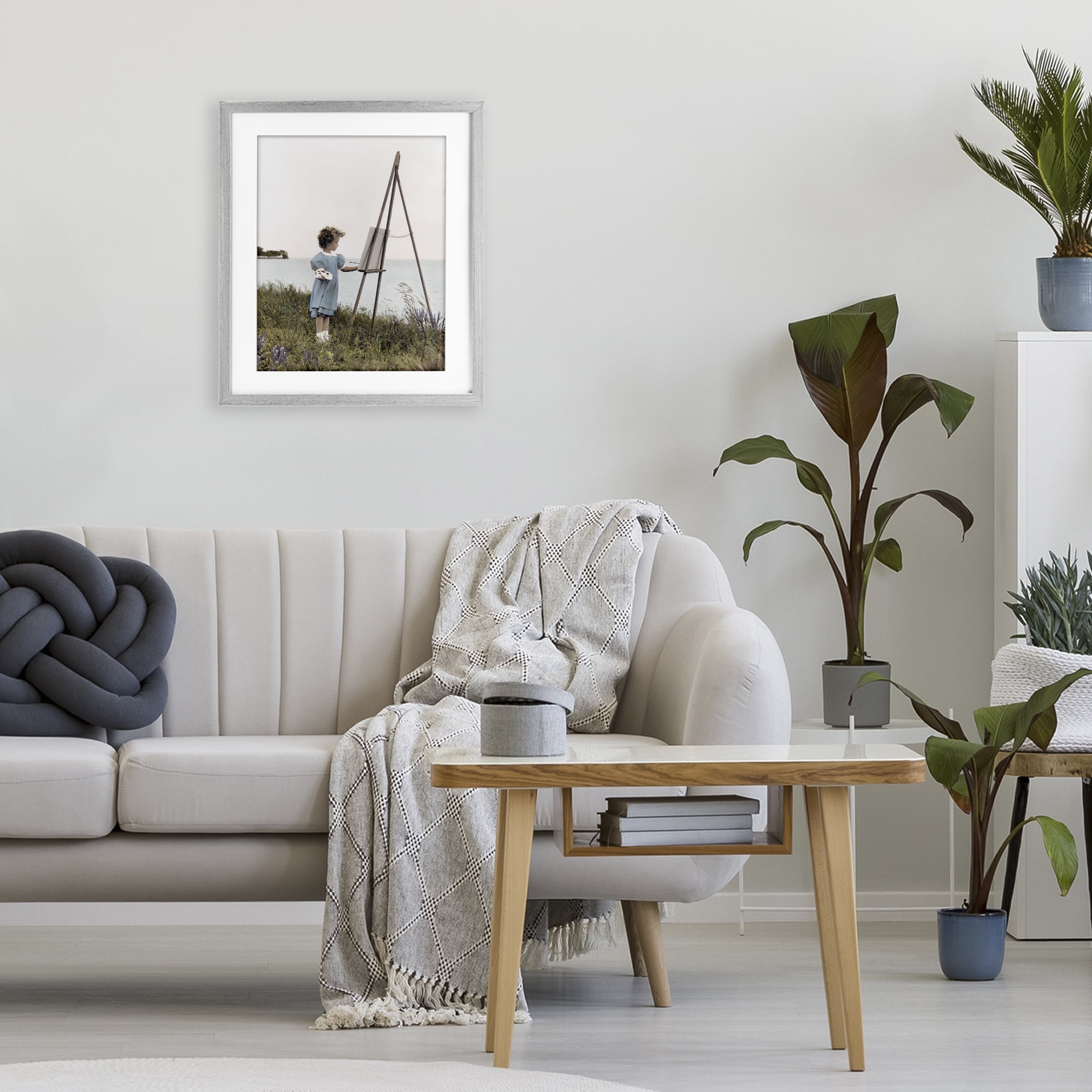 Stupell Industries Child Painting on Easel Gray Framed Print Under Glass, design by Kendra Dew