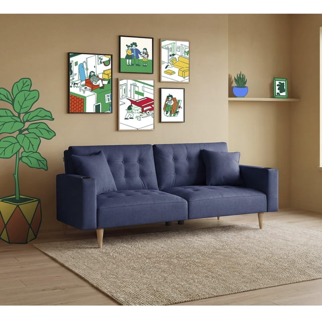 sofá cama makora maxim azul lino 3 posiciones con soft foam reclinable sofá cama convertible azul tipo lino con respaldo dividido en 3 posiciones independientes (recto, reclinado o cama), portavasos ocultos en los brazos, dos cojines decorativos y patas cónicas visibles; vista frontal 3/4 en sala con alfombra y cuadros, ideal para 2 personas y espacios pequeños, frecuentemente usado como cama ocasional para visitas.