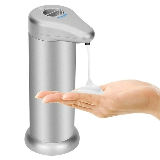 Toytexx Automatic Soap Dispenser, 300ml Infrared Motion Sensor Foam Soap Dispenser in silver. The dispenser features a sleek cylindrical design with a touch-free operation, dispensing foam soap into a hand placed below the nozzle. Made of ABS material, it has a compact size of 21 x 10.5 x 8.5 cm, ideal for kitchens and bathrooms. Operates with 4 AAA batteries (not included) and is compatible with various liquid types like hand soap and sanitizers. The waterproof base ensures durability and prevents corrosion.