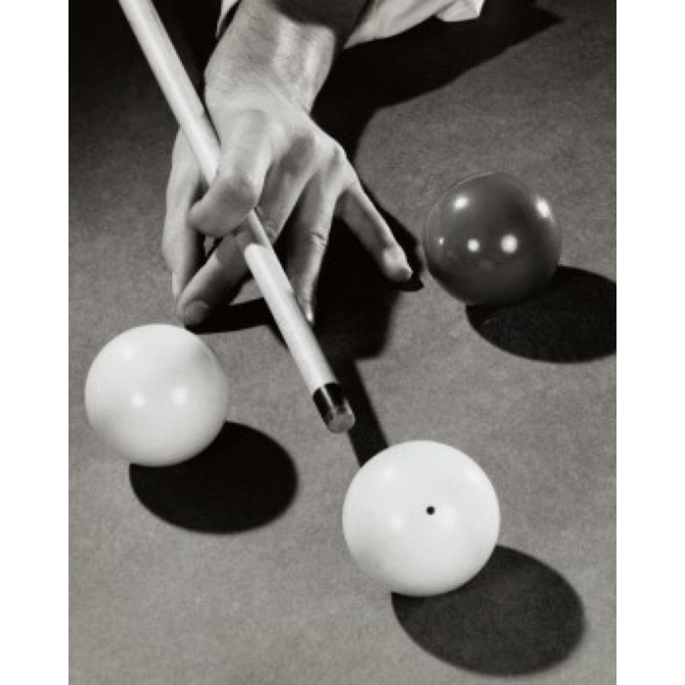 High angle view of a man's hand hitting a pool ball with a cue stick