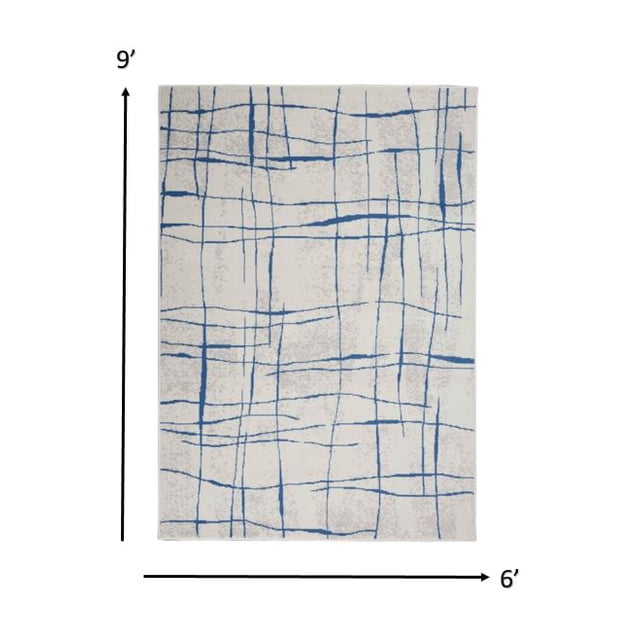 homeroots home decor 385864 6’ x 9’ Ivory and Blue Irregular Grids Area Rug