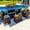 Sunbrella Canvas Navy, variant on Tuscany 7-Piece Outdoor Patio Furniture Sectional Sofa Set with Four Modular Sectional Pieces, Armchair, Ottoman, and Coffee Table (Half-Round Brown Wicker, Polyester Light Gray)