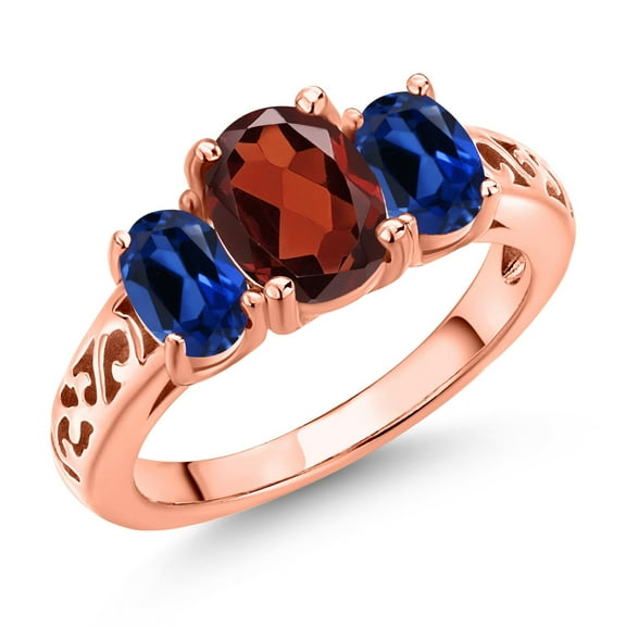 Gem Stone King 18K Rose Gold Plated Silver Red Garnet and Blue Created Sapphire Filigree Style 3 Stone Ring for Women (2.70 Cttw, Oval 8X6MM and 6X4MM) (Size 8)