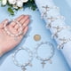 thumbnail image 3 of Pulsera de rosario elástica de 24 cuentas con bolsitas de malla, ideal para bautizo o comunión. Pulseras de conchas marinas en color concha, con crucifijo., 3 of 9