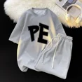 thumbnail image 4 of Conjunto de dos piezas deportivo de gran tamaño de estilo universitario japonés y coreano para hombre y niño, camiseta holgada informal de manga corta y pantalones cortos, 4 of 5