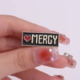 thumbnail image 2 of Broche de aleación esmaltada negra con forma de corazón Mercy con forma de corazón y oro, 3 x 1,2 cm, 2 of 2