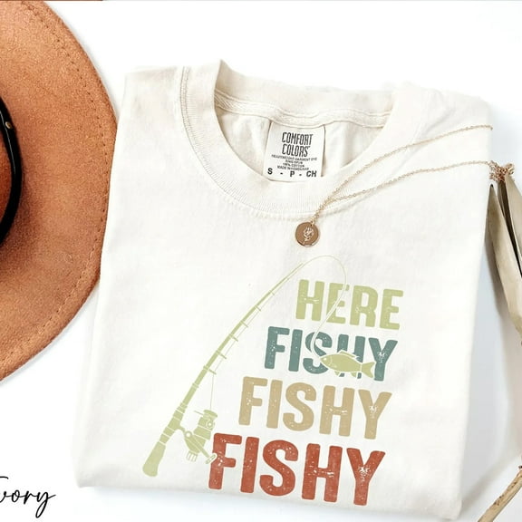 Here Fishy Fishy Fishy T-Shirt – Funny Fishing Tee for Men & Women – Playful Angler Shirt with Rod & Fish Graphic