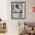 thumbnail image 3 of Historic Framed Print, [Alma Hitchcock, three-quarter length portrait, left profile, holding poster of Alfred Hitchcock's film, Rear window"]", 17-7/8" x 21-7/8", 3 of 9
