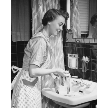 Side Profile Of A Young Woman Hand Washing Clothes In The Bathroom Sink Canvas Art 18 X 24