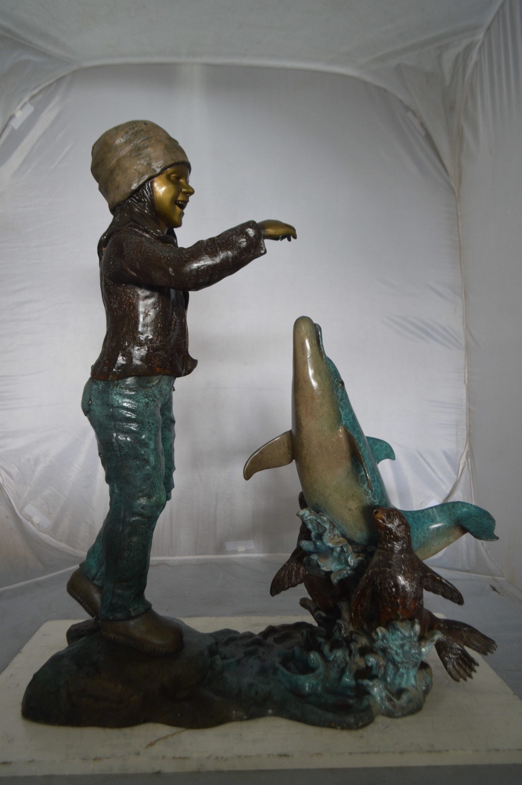 Nifao Girl feeding a dolphin and seals – Outdoor Bronze Fountain, Garden Water Feature, 28"L x 17"W x 37"H
