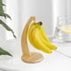 thumbnail image 1 of Colgador de Plátanos de Madera Sólida Natural, 10.6"x6.9"x4.9" Soporte para Frutas Marrón con Base Estable y Gruesa, Diseño de Circulación de Aire para Mayor Frescura, Organizador Multiusos para, 1 of 6