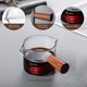 thumbnail image 3 of Paquete de 2 tazas medidoras YUANXCMXG con doble boquilla y mango de madera 75 ml, 3 of 5