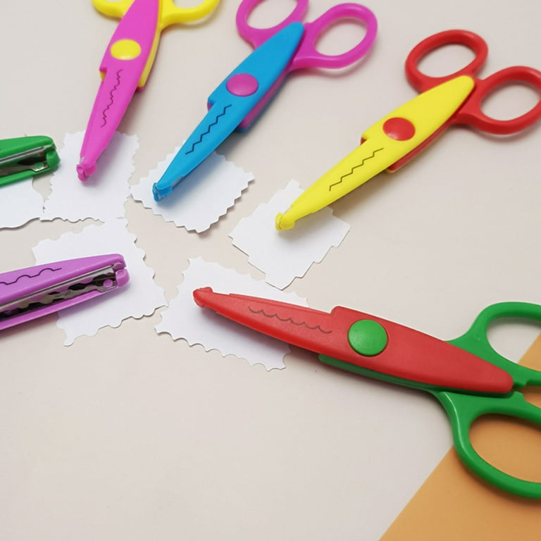 Colorful zigzag scissors with color paper isolated on white Stock Photo -  Alamy