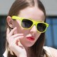 thumbnail image 3 of Una boutique de gafas de sol unisex con montura amarilla limón y lentes negras para adultos. Rojo Verde, 3 of 5