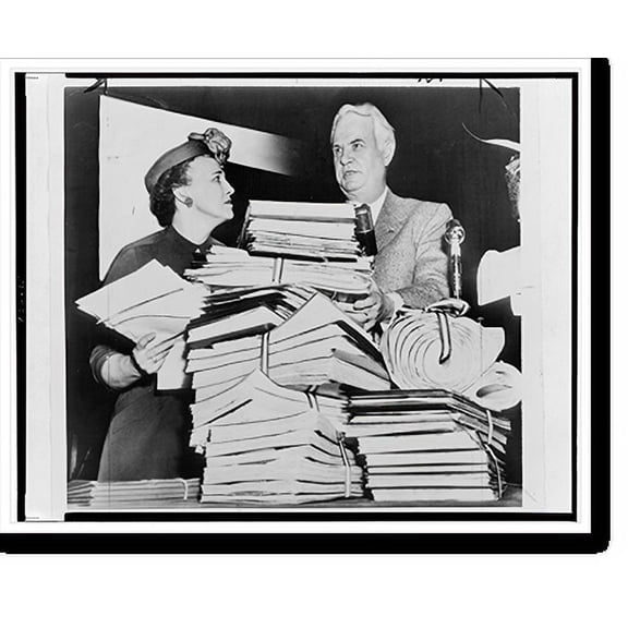 Historic Print, [Senator John Bricker and Mrs. Robert Murray stand behind mound of petitions supporting his constitutional amendment limiting presidential treaty-making powers], 18" x 24"