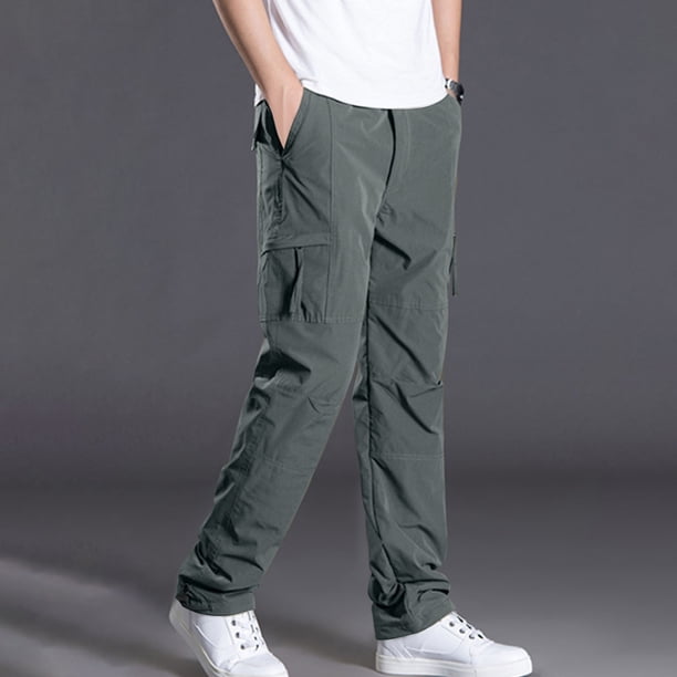 Pantalones largos de poliéster para hombre, de color liso, informales, con botones, cintura elástica y múltiples bolsillos.