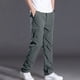 thumbnail image 1 of Pantalones largos de poliéster para hombre, de color liso, informales, con botones, cintura elástica y múltiples bolsillos., 1 of 9