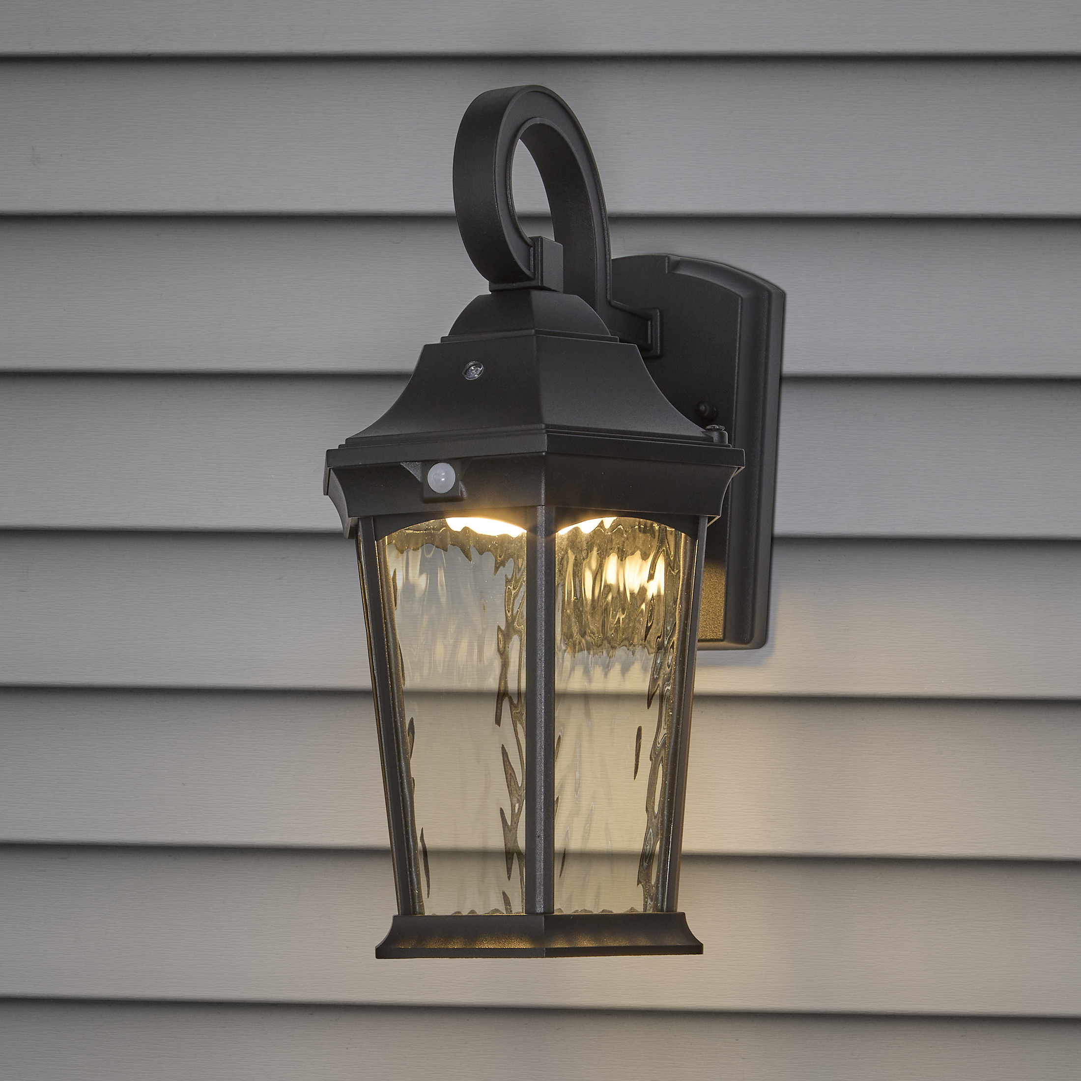 Maxxima LED Motion Sensor Outdoor Wall Light, Dusk to Dawn Sensor, Black w/ Clear Water Glass, 800 Lumens, 3000K Warm White
