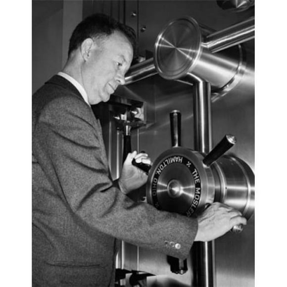 Posterazzi SAL2554349 Mature Man Opening the Door to a Bank Vault Poster Print - 18 x 24 in.