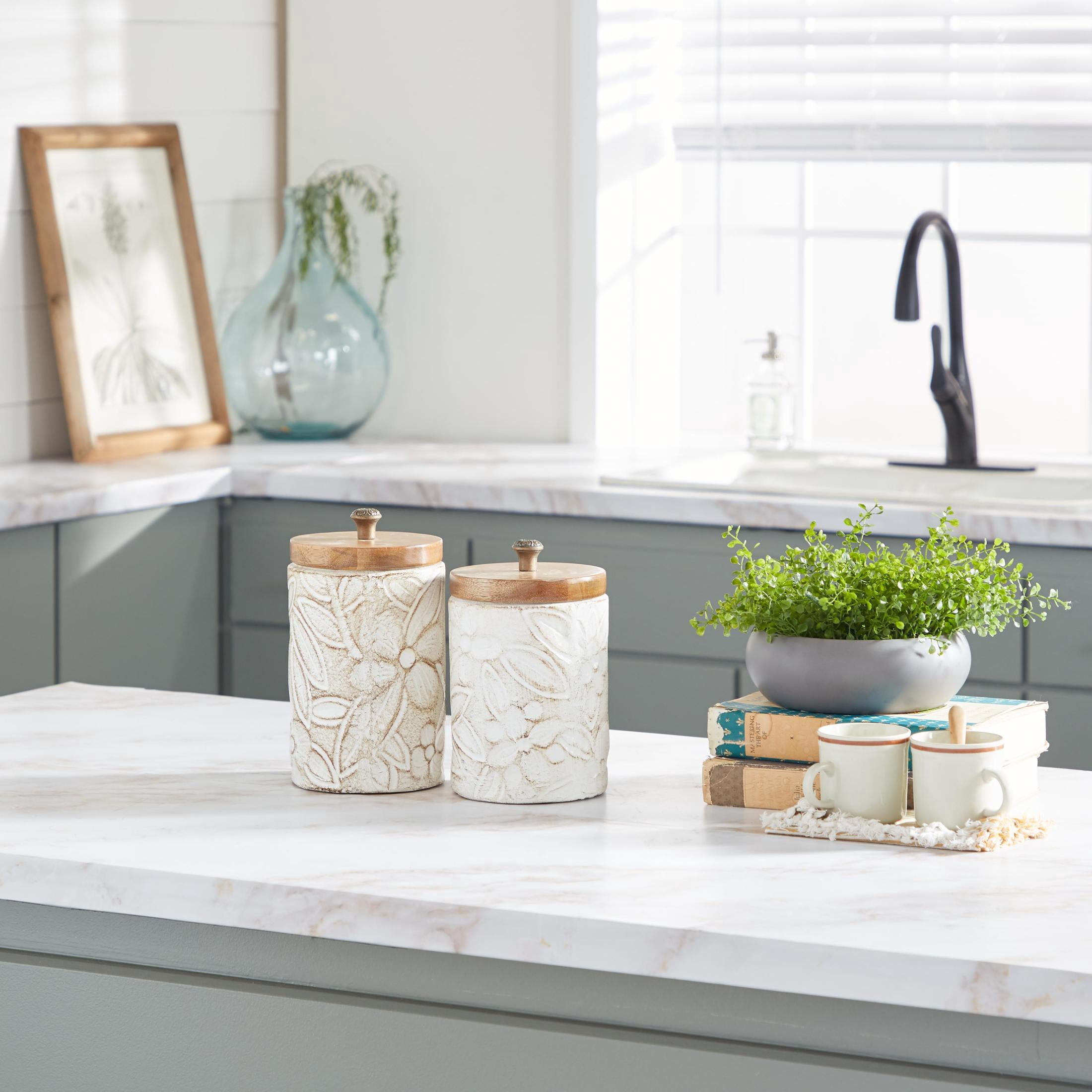 DecMode 9", 11"H White Ceramic Floral Handmade Intricately Carved Decorative Jars with Wood Lids, 2-Pieces