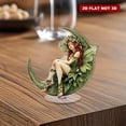 thumbnail image 1 of Ornement en Acrylique Rotatif avec une Fée Verte aux Cheveux Rouges sur une Lune en Croissant Portant un costume de Feuille et Tenant une Branche d'Olivier, 1 of 8