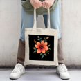 thumbnail image 2 of Vibrant Orange Flower Canvas Tote Bag with Green Leaves on Dark Background Perfect for Shopping Travel and Parties, 2 of 4