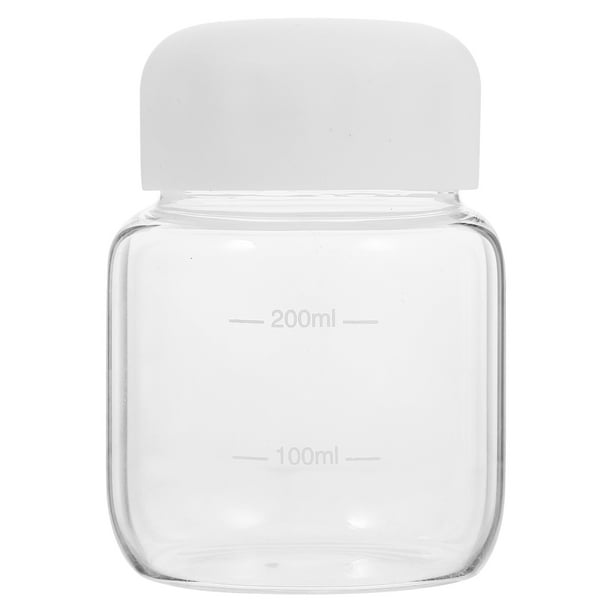 Botella de agua de vidrio transparente, pequeña, para jugo, leche o café.