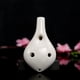 thumbnail image 4 of Ocarina de cerámica en tono Do alto, pintada a mano con diseño de flores, incluye partitura y cordón para colgar. Ideal para amantes de la música y principiantes., 4 of 6