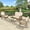Brown Wicker/Beige Cushions, variant on 4 Pieces Outdoor Wicker Patio Furniture Set, All Weather Patio Conversation Cushioned Sectional Sofa Set with Glider Loveseat/2 Rocking Chairs/Matching Glass Coffee Table, Navy