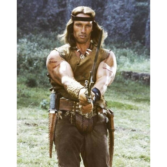 Arnold Schwarzenegger as Conan the Barbarian brandishing sword poster 24x36