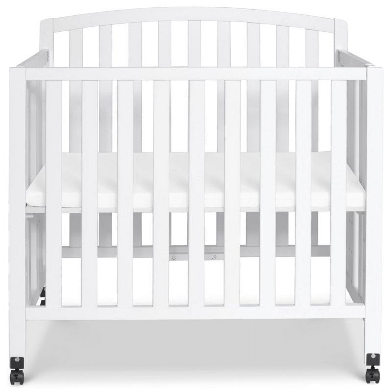 DaVinci Dylan Folding Portable 3-in-1 Mini Crib and Twin Bed in White
