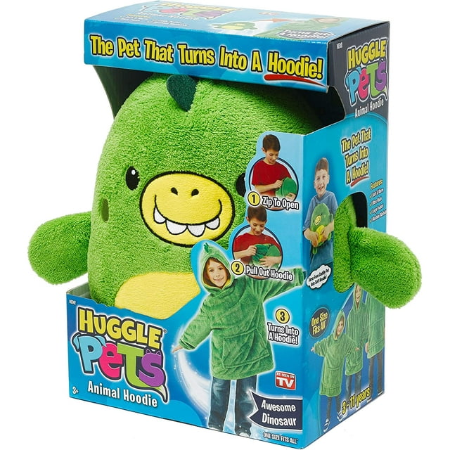 Huggle Pets green dinosaur plush toy that converts into a children's hoodie, displayed in colorful box with step-by-step transformation guide.