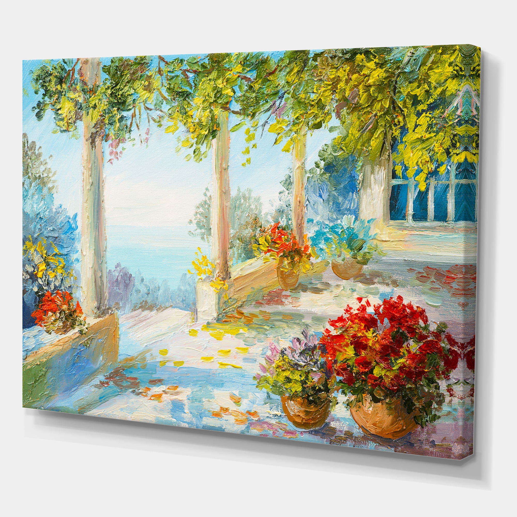 Designart ' Terrace With Red Flowers Near The Sea ' Nautical & Coastal Canvas Wall Art Print