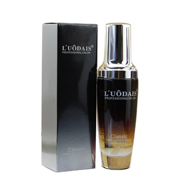 aceite esencial para cabello de 80ml, repara daños y sequedad: frasco frontal degradado oscuro con tapa plateada y caja negra al lado; tratamiento sin enjuague para suavizar y controlar el frizz, fragancia elegante; también suele usarse para domar puntas abiertas y añadir brillo temporal.