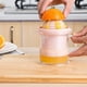 thumbnail image 5 of Exprimidor de frutas sencillo de cocina, multifunción, a presión manual, para frutas y verduras, minimáquina exprimidora de frutas, práctico accesorio de cocina (rosa), 5 of 6