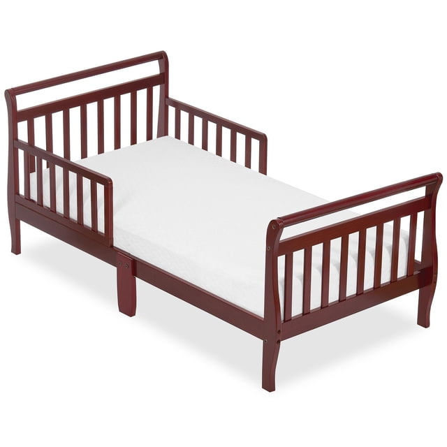 Dream On Me Sleigh toddler bed in dark wood finish featuring sleigh-style headboard and footboard, shown with a white mattress.