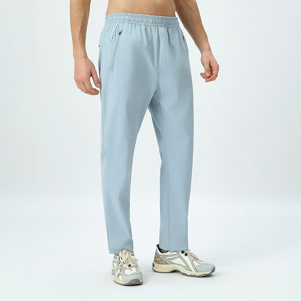 Pantalones largos casuales de color liso para hombre, con cintura elástica y bolsillos, de nailon