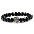 thumbnail image 1 of Pulsera con dije de huella de pata de piedra volcánica de lava negra mate natural, ideal como recuerdo para mascotas, amantes de los gatos y los perros., 1 of 2