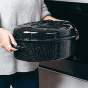 Granite Ware 19 inch oval roaster with Lid enameled steel design to accommodate up to 20 lb poultry/roast. Resists up to 932°F